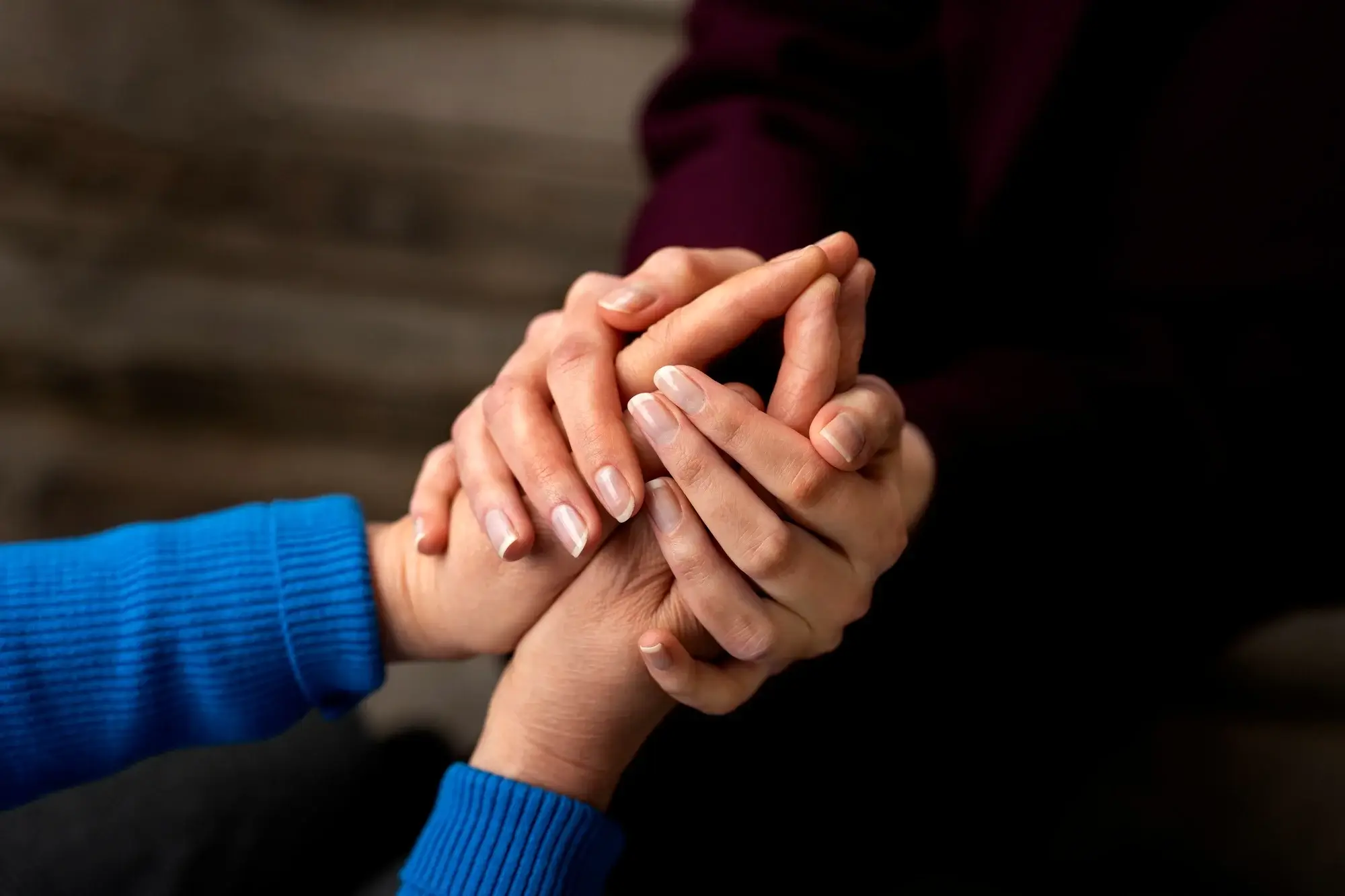 Supportive hands holding each other symbolize the compassionate care provided by our intensive outpatient program in Missouri.