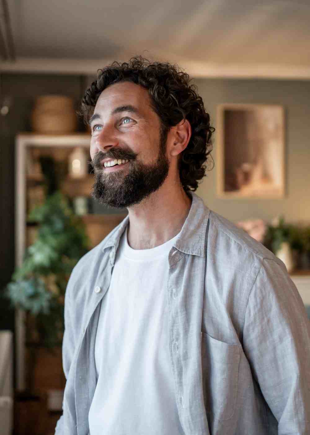 Man looking hopeful at window during fentanyl addiction recovery and mental health healing