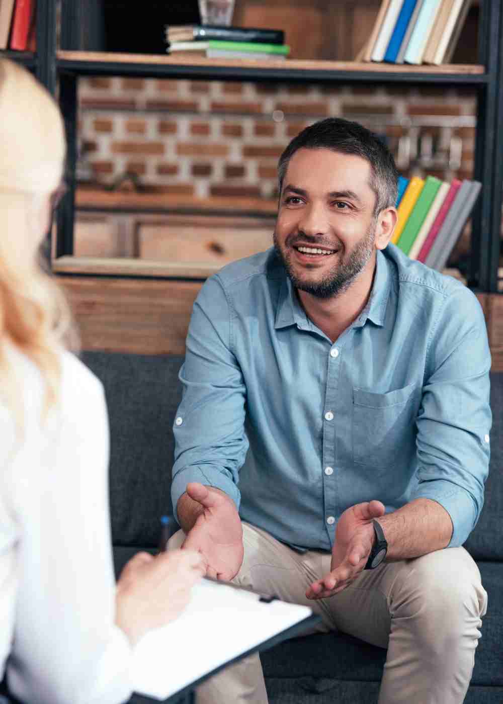 Man speaking with a therapist during an individual addiction counseling session