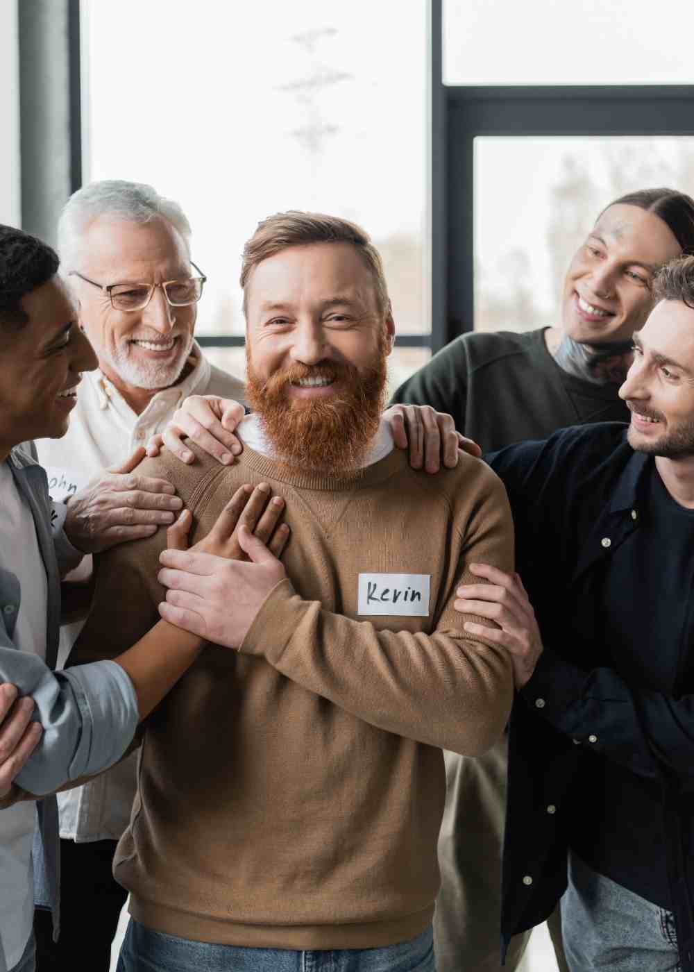 People showing encouragement and peer support during an addiction recovery group session