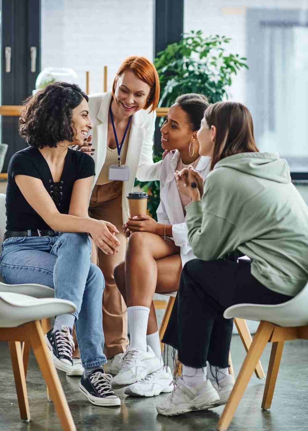 Mental health therapist facilitating a supportive group therapy session with participants