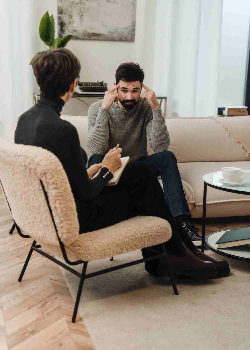 Man discussing anxiety and intrusive thoughts with a licensed therapist during an individual counseling session