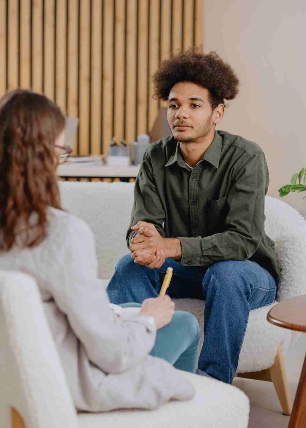 Young adult participating in an individual psychotherapy session with a mental health counselor