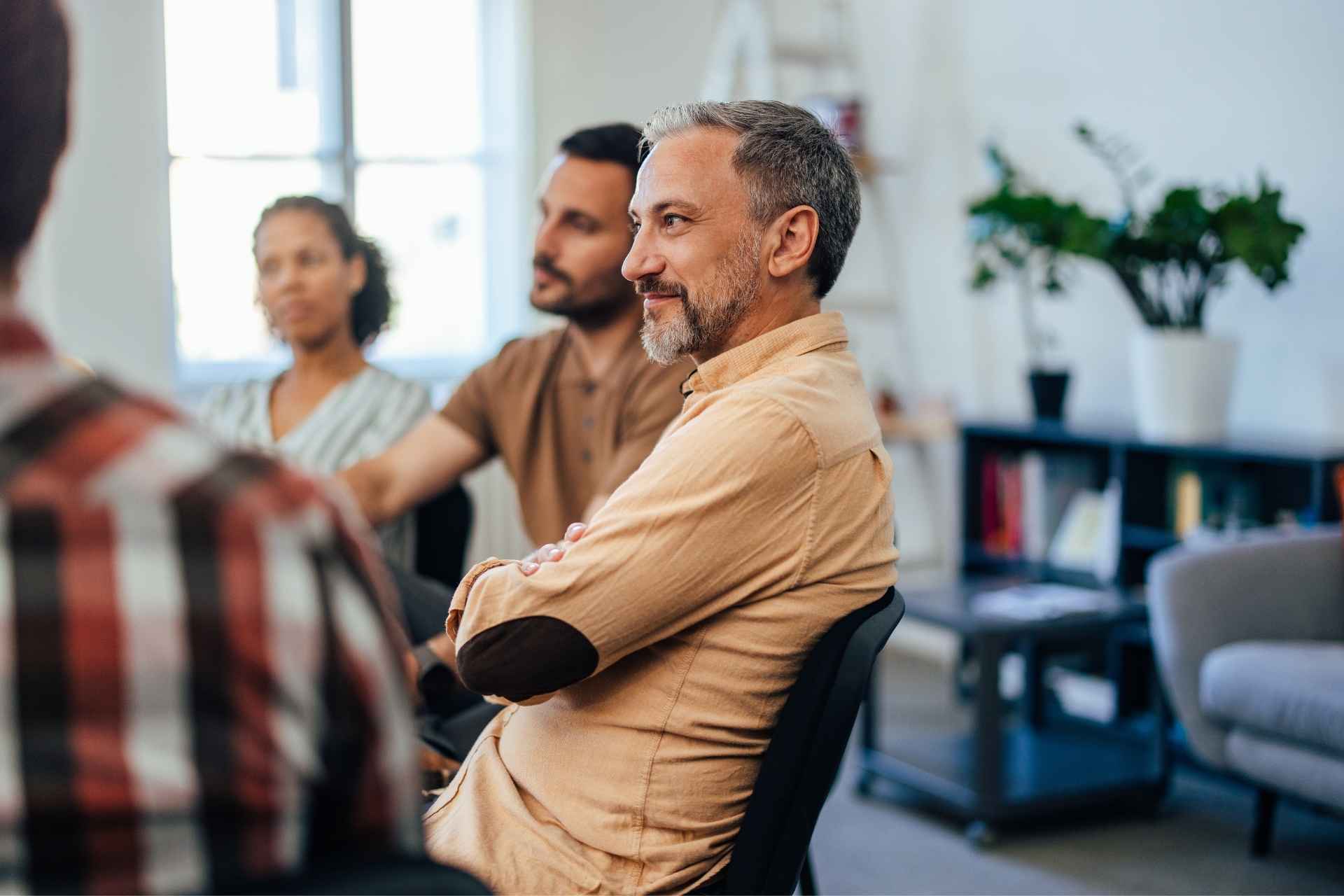 Man participating in a support group during addiction recovery